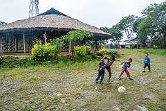 Boys playing football in front of the Angh's house in Sheanghah Chingnyu.