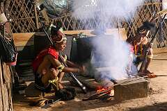 Lokom and Pango, Konyak Naga mae at a fireplace in Tonyei Ahng's house in the village of Sheanghah Chingnyu.
