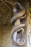 Wood carving of a snake and a lizard in the Garo Murung, a traditional 'bachelors' dormitory' house in Kisama Heritage Village.