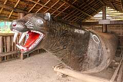 Antimonyu, the log drum in the Morung, traditional 'bachelors' dormitory' house of the Chang tribe in Kisama Heritage Village. It has a carved leopard's head.