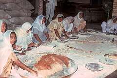 Women making chapattis, in the kitchen at the Golden Temple in Amritsar. Food is served to all visitors who want it, regardless of faith, gender or economic background.