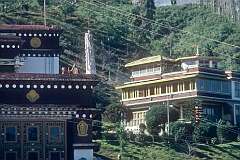 Rumtek Monastery, the Dharma Chakra Centre, with a monk beating a drum.