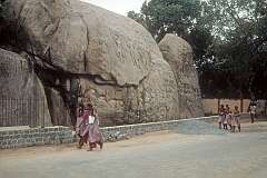 School girls walking past one of the many bas reliefs in Mahabalipuram.