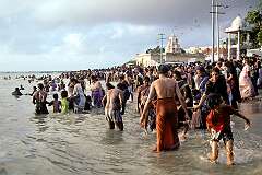 Hindu devotees bathing in the sea in Agnitheertham, the most prominent and popular spot for sea bathing in Rameswaram, located on the eastern side of the temple.