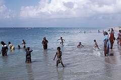 Women and children bathing in the sea in Dhanushkodi.