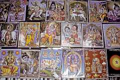 Religious posters featuring Hindu gods for sale at the Ramanathaswamy Temple in Rameswaram.