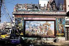 A bas-relief on a panel topped with statues along South Masi Road in Madurai.