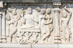 Carvings of the life of the Buddha on the base of the Buddha statue on Gibraltar Rock in the middle of Hussain Sagar lake, at Lumbini Park.