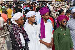 Turbaned men posing near the Charminar.