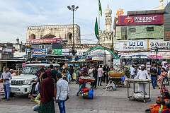 Near the Charminar, with the Machli Kaman gate and the minaret of the Shujaiya mosque (Jama Masjid Shujaiya), built in 1597, in the background.