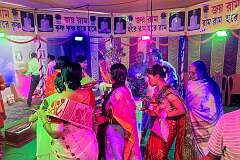 Women dancing to honour a recently deceased guru, in a Hindu “puja” ceremony.