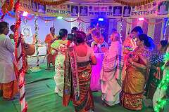 Honouring a recently deceased guru in a temporary temple in Agartala.