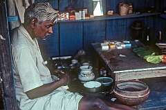 A seller of sirih in his little shop in Varanasi.