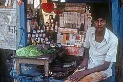 A shopkeeper in front of his little shop in Varanasi.