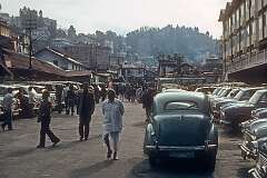 Taxi stand in the centre of Darjeeling with one Austin A-40 and many Hindustan Ambassadors.
