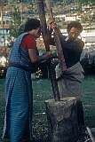 Ponding barley in a mortar at the Jangsa monastery.