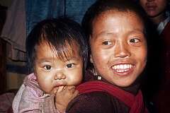 Bhutanese brothers Rinchin Dorjee, with Rinchin Paden on his back at Jangsa Gompa.