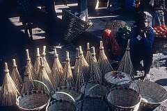 Selling baskets and brooms at Raja Dorjee Market.