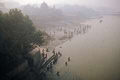Men washing in the Hooghly River at Mallick Ghat, view from the Howrah Bridge, Kolkata.