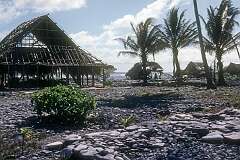 Battered houses along the lagoon in Roreti village, in the south of Arorae island, south Kiribati.