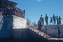 People waving goodbye from the harbour in Uma (Umwa) on Banaba
