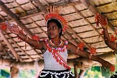 A girl performing traditional dancing in the maneaba “Te Aake” in Ukiangang, Butaritari
