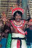 A man, dressed in a mat, dancing in the maneaba “Te Aake” in Ukiangang, Butaritari atoll.