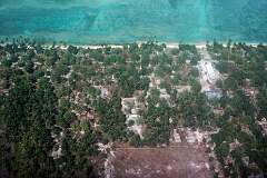 Flying over the village on Kiebu island, in the south of Makin atoll.
