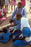 A priest blessing a child during the service of the Saint Luke Apostolic Church in Manicaland, in east Zimbabwe.