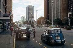 Jameson Avenue in Salisbury, as it was called in 1975, the capital of (South) Rhodesia; now Harare, the capital and most populous city of Zimbabwe; The street was renamed Samora Michel Avenue in the early 1980s.