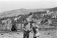 Sarajevo, Bosnia - Young boys happy to pose in the upper town; view to Jajce Barracks, now Kasarna Safet Hadžić.