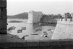 Dubrovnik, Croatia - View from the city wall to the harbour and Old Town, encircled with 16th century massive stone walls.