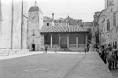 Trogir, Croatia - The clock tower on Trg Ivana Pavla II square in the medieval town of Trogir, on a tiny island.